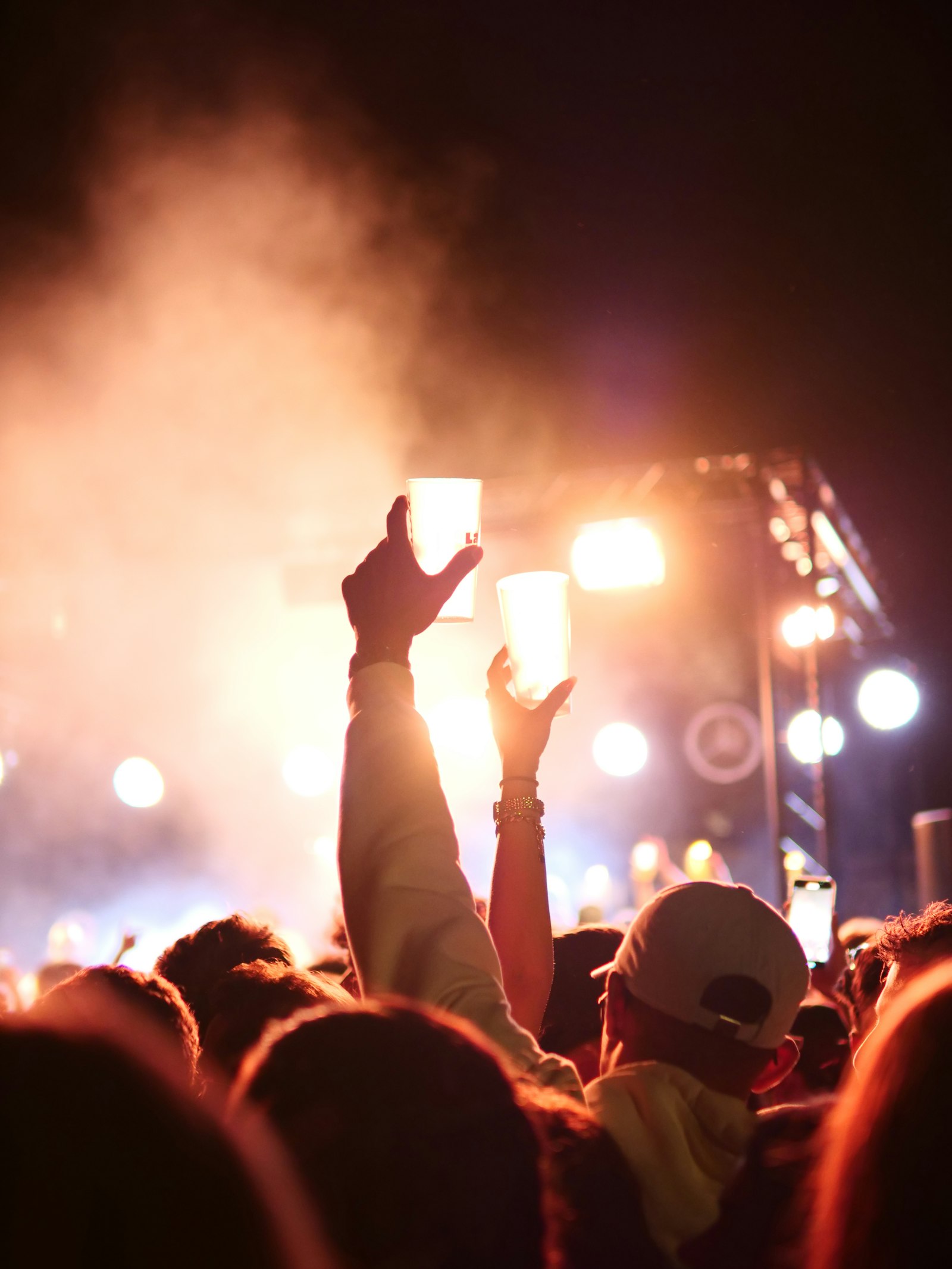Crowd holding up lights at a concert